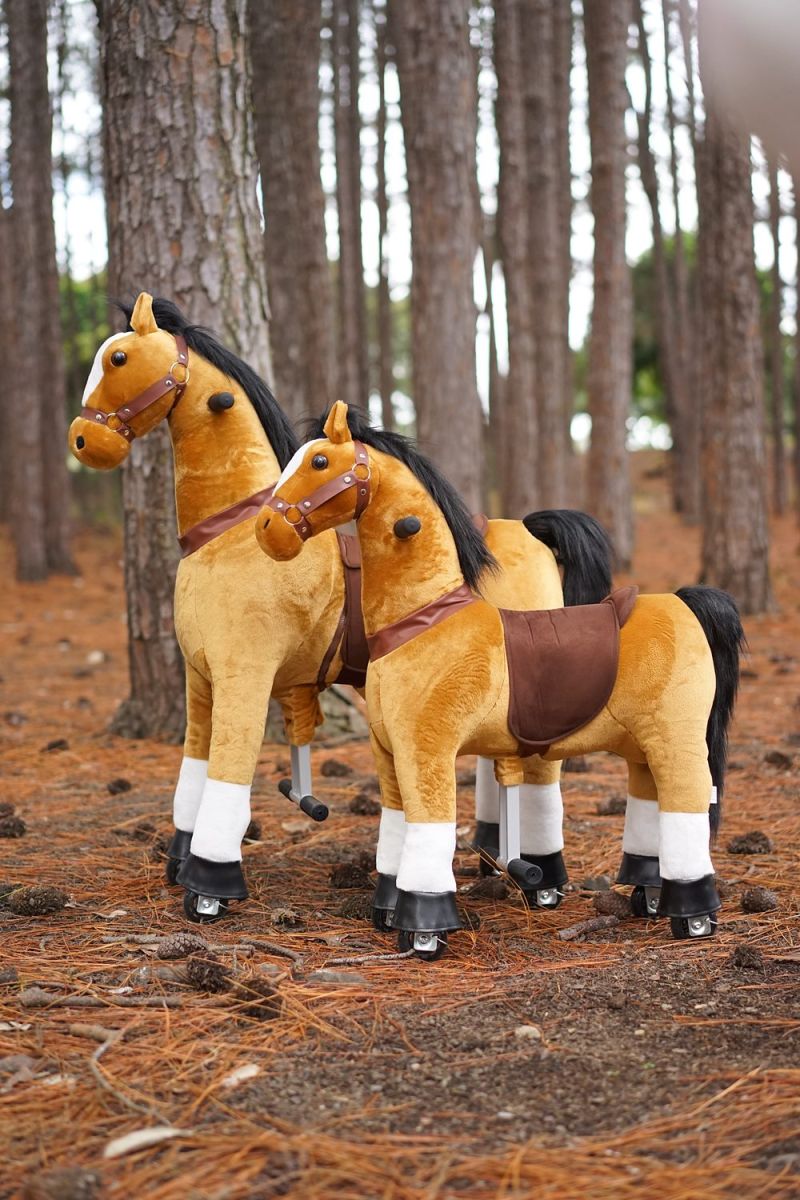 Little Riders brown ride-on horse toy - large and small brown ride-on horses among the pine trees