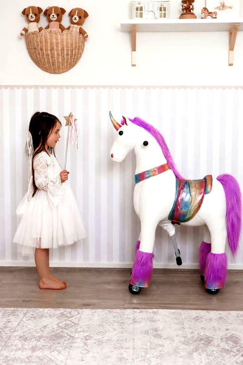 Little Riders unicorn ride-on toy - girl with fairy wand meeting her unicorn