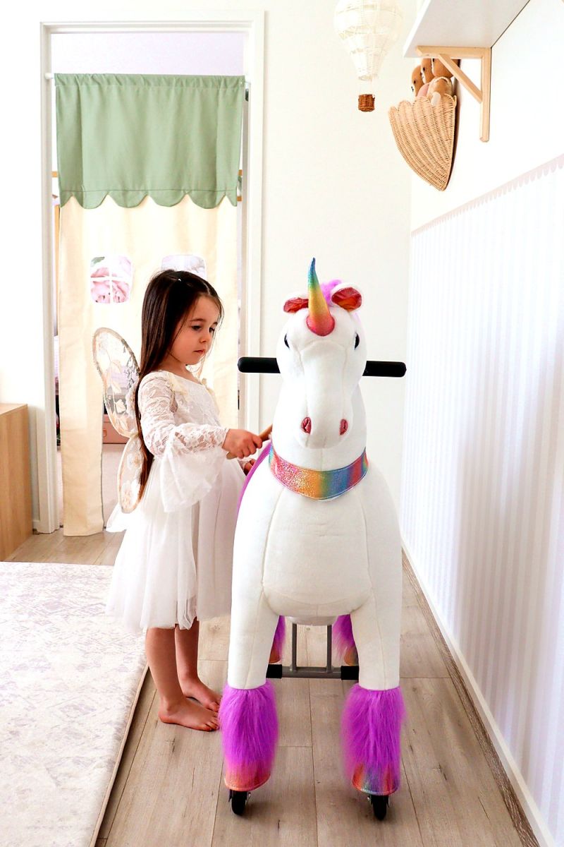 Little Riders unicorn ride-on toy - girl ready to ride her unicorn